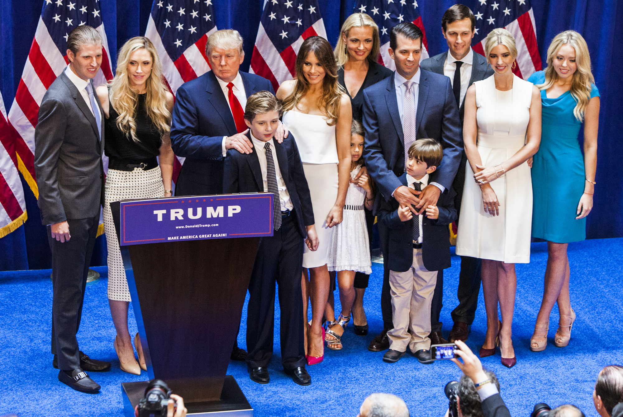 NEW YORK, NY - JUNE 16: (L-R) Eric Trump, Lara Yunaska Trump, Donald Trump, Barron Trump, Melania Trump, Vanessa Haydon Trump, Kai Madison Trump, Donald Trump Jr., Donald John Trump III, Jared Kushner, Ivanka Trump, and Tiffany Trump pose for photos on stage after Donald Trump announced his candidacy for the U.S. presidency at Trump Tower on June 16, 2015 in New York City. Trump is the 12th Republican who has announced running for the White House. (Photo by Christopher Gregory/Getty Images)