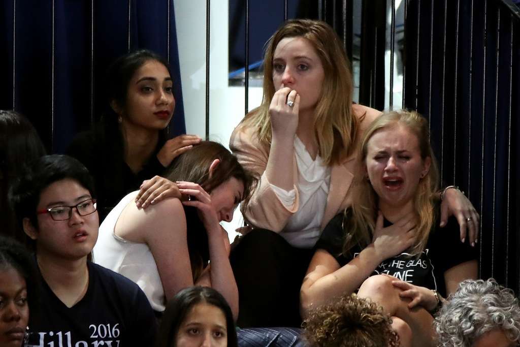 NEW YORK, NY - NOVEMBER 08: A group of women react as voting results come in at Democratic presidential nominee former Secretary of State Hillary Clinton's election night event at the Jacob K. Javits Convention Center November 8, 2016 in New York City. Clinton is running against Republican nominee, Donald J. Trump to be the 45th President of the United States. (Photo by Drew Angerer/Getty Images)